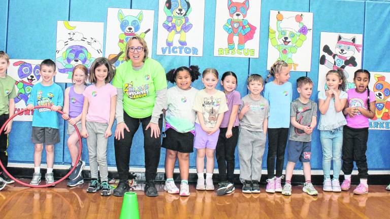Students pose with a teacher at the Kids Heart challenge.